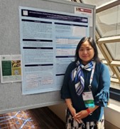 Flora Wang, PhD presenting research poster